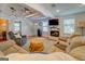 Relaxing living room featuring shiplap walls, a cozy fireplace, and comfortable seating at 22 Waters Bridge Cir, Covington, GA 30014