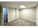 Basement featuring plush carpeting, neutral walls, and an open doorway leading to the staircase at 4467 Thornwood Cres, Stone Mountain, GA 30083