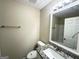 Bathroom with a granite-topped vanity and a large mirror and modern fixtures at 4467 Thornwood Cres, Stone Mountain, GA 30083