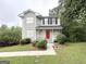 Charming two-story home with a well-manicured front lawn and lush landscaping at 4467 Thornwood Cres, Stone Mountain, GA 30083