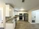 Modern kitchen with white cabinetry, stainless steel appliances, and granite countertops at 4467 Thornwood Cres, Stone Mountain, GA 30083