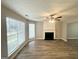 Spacious living room featuring wood floors, a fireplace, and bright natural lighting at 4467 Thornwood Cres, Stone Mountain, GA 30083