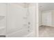 Bathroom featuring a white tub and shower combination with built-in shelving at 116 Cabin Way, Hampton, GA 30228