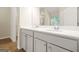 Bathroom vanity with double sinks, a quartz countertop, and light gray cabinets at 116 Cabin Way, Hampton, GA 30228