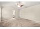 Spacious carpeted bedroom featuring a ceiling fan, and an ensuite bathroom at 116 Cabin Way, Hampton, GA 30228