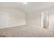 Bedroom featuring plush carpeting, and a vaulted ceiling with ample natural light at 116 Cabin Way, Hampton, GA 30228
