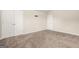 Bedroom featuring plush carpeting and a double door closet for storage solutions at 116 Cabin Way, Hampton, GA 30228