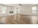 Bright living room with modern fireplace, vinyl flooring, and ample natural light at 116 Cabin Way, Hampton, GA 30228