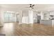 Open-concept living area with luxury vinyl plank flooring, flowing into the kitchen and dining areas at 116 Cabin Way, Hampton, GA 30228