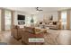 Bright living room with modern fireplace, comfortable seating, and ample natural light at 116 Cabin Way, Hampton, GA 30228