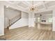 Spacious living area showcasing ceiling beams, stairs, and an open layout with neutral color tones at 116 Cabin Way, Hampton, GA 30228