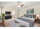 Spacious main bedroom with vaulted ceiling, fan, and ensuite bathroom access at 116 Cabin Way, Hampton, GA 30228