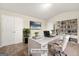 Home office showcasing a large white desk, built-in bookshelves, and a comfortable chair at 116 Cabin Way, Hampton, GA 30228