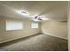 Finished basement space with carpet and a ceiling fan; ideal for recreation at 815 Magna Carta Nw Dr, Atlanta, GA 30318
