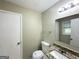 Clean bathroom features a granite countertop, single sink, and a large mirror at 815 Magna Carta Nw Dr, Atlanta, GA 30318