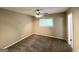 Comfortable bedroom with neutral color palette, plush carpet, and a ceiling fan at 815 Magna Carta Nw Dr, Atlanta, GA 30318