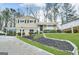 Charming two-story home with manicured lawn and attached carport offers inviting curb appeal at 815 Magna Carta Nw Dr, Atlanta, GA 30318