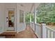 Covered back porch with tile flooring and access to backyard at 120 Hamilton Glen Ct, Fayetteville, GA 30215