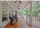 Spacious covered porch offers view of backyard and seating for outdoor entertainment at 120 Hamilton Glen Ct, Fayetteville, GA 30215