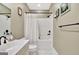Bathroom showcasing white fixtures, a shower-tub combination, and neutral color scheme at 120 Hamilton Glen Ct, Fayetteville, GA 30215