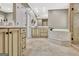 Bright bathroom featuring a soaking tub, glass enclosed shower, and custom cabinetry at 120 Hamilton Glen Ct, Fayetteville, GA 30215