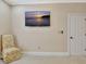 Bedroom shows a chair, wall-mounted TV, door to bathroom, and neutral paint at 120 Hamilton Glen Ct, Fayetteville, GA 30215