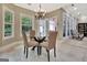 Bright breakfast nook with windows and glass doors to porch for casual dining at 120 Hamilton Glen Ct, Fayetteville, GA 30215