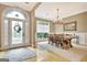 Formal dining area with chandelier, window, and decorative rug at 120 Hamilton Glen Ct, Fayetteville, GA 30215
