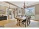 Elegant dining area featuring a wooden table, chandelier, and view of the foyer at 120 Hamilton Glen Ct, Fayetteville, GA 30215