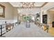 Dining room with chandelier, table, and view to the living room at 120 Hamilton Glen Ct, Fayetteville, GA 30215