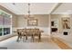 Bright dining room area with chandelier, table, and chairs at 120 Hamilton Glen Ct, Fayetteville, GA 30215
