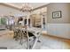 Dining room with chandelier, table, chairs, and wainscoting at 120 Hamilton Glen Ct, Fayetteville, GA 30215
