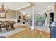 View of the dining room, columns, and open concept living area at 120 Hamilton Glen Ct, Fayetteville, GA 30215