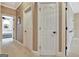Hallway with white trim and neutral walls, showcasing access to various rooms in the home at 120 Hamilton Glen Ct, Fayetteville, GA 30215