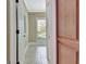 Hallway with tile flooring and view into a room through an open door at 120 Hamilton Glen Ct, Fayetteville, GA 30215