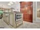 Kitchen island with built-in microwave, cabinets, and view of large pantry at 120 Hamilton Glen Ct, Fayetteville, GA 30215