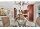 Open-concept kitchen with dark wood cabinets that overlooks the breakfast nook and living area at 120 Hamilton Glen Ct, Fayetteville, GA 30215