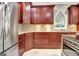 Beautiful kitchen featuring cherry cabinets, granite counters, and stainless steel appliances at 120 Hamilton Glen Ct, Fayetteville, GA 30215