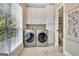 Convenient laundry room features modern appliances, ample cabinet space, and natural light at 120 Hamilton Glen Ct, Fayetteville, GA 30215