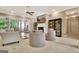 Bright and airy living room with large windows, fireplace, and comfortable seating arrangements at 120 Hamilton Glen Ct, Fayetteville, GA 30215