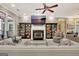 Spacious living room featuring a fireplace, built-in shelving, and comfortable armchairs at 120 Hamilton Glen Ct, Fayetteville, GA 30215