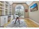 Home office includes built-in shelving, a modern desk, and decorative rug at 120 Hamilton Glen Ct, Fayetteville, GA 30215