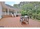 Paver patio with outdoor furniture next to a brick and vinyl sided house at 120 Hamilton Glen Ct, Fayetteville, GA 30215