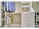 Spacious walk-in closet with custom shelving, drawers, and hanging racks for organization at 120 Hamilton Glen Ct, Fayetteville, GA 30215