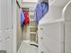 Organized walk-in closet featuring custom shelving and drawers for efficient storage and functionality at 120 Hamilton Glen Ct, Fayetteville, GA 30215