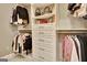 Custom walk-in closet featuring adjustable shelves, drawers, and organized racks for clothing and accessories at 120 Hamilton Glen Ct, Fayetteville, GA 30215