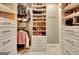 Spacious walk-in closet with custom shelving and drawers, perfect for organizing shoes and clothing at 120 Hamilton Glen Ct, Fayetteville, GA 30215