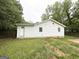 The backyard features a white siding house with a fenced yard, offering privacy and outdoor space at 4162 Mercer Rd, Decatur, GA 30035