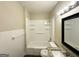 Bathroom with tiled shower-tub combo, granite vanity, contemporary mirror and updated light fixture at 4162 Mercer Rd, Decatur, GA 30035