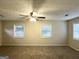 Spacious bedroom with multiple windows and ceiling fan provides comfort and plenty of natural light at 4162 Mercer Rd, Decatur, GA 30035